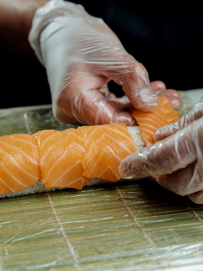 Pressing nigiri at the counter